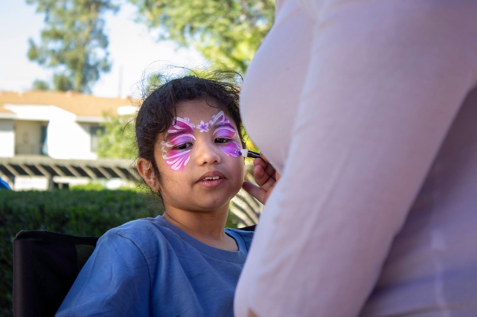 Butterfly face paint in progress